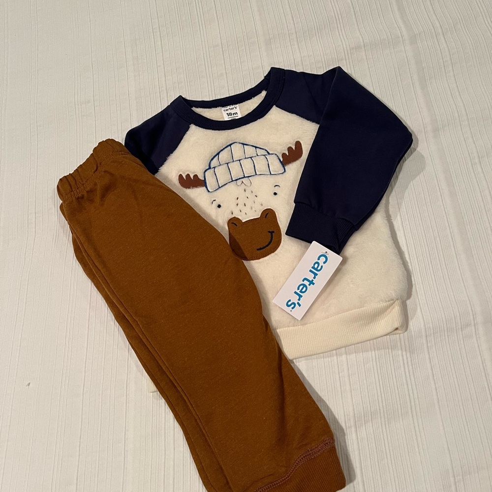 Carters sweatshirt and pants. Never worn, tags on. 18 months.